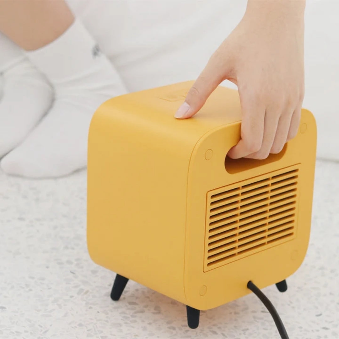 Compact Electric Heater 700W Portable Heating Appliance Orange White Yellow For Office And Home Use | Sansoti