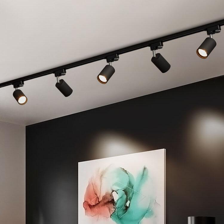 Adjustable ceiling track system with 3-5 spotlights, black, white and gold, dimmable, warm light, modern living room interior | Sansoti