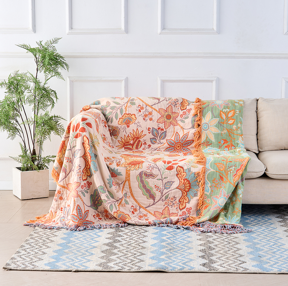 Baumwollplaid mit Boho Blumenmuster – Orange und Blau auf cremefarbenem Untergrund mit Fransen – Dekorative Tagesdecke für Sofa und Bett | Sansoti
